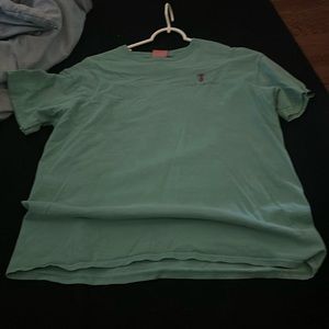 This shirt is an aqua simply southern shirt with purple designs and is a large.